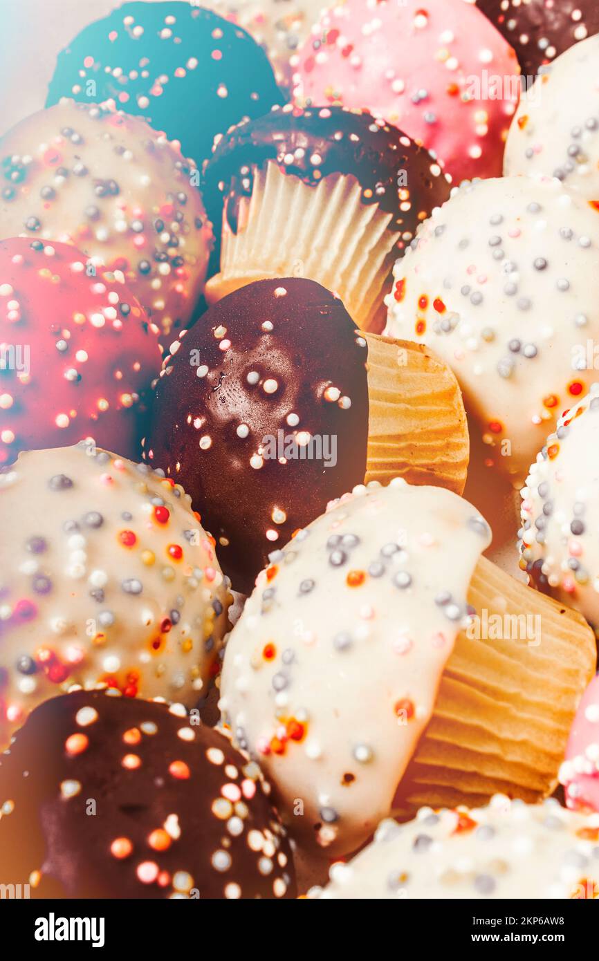 Group of sweet delicious cupcake confection laying in an assorted lot