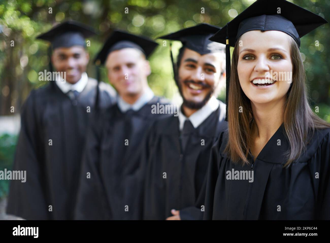 Theyre proud graduates. Portrait of a group of happy students on graduation day Stock Photo Alamy