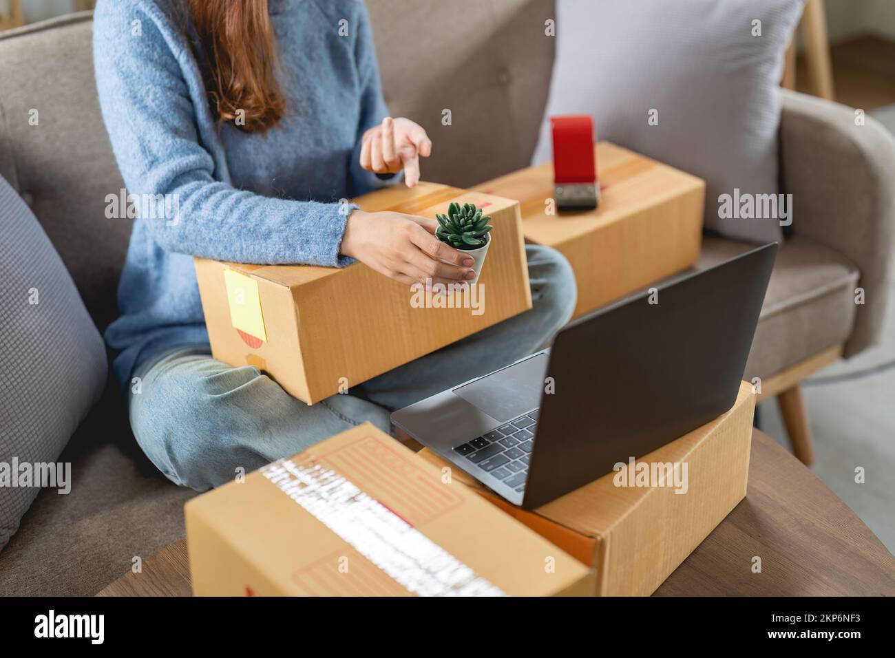 Business Start up SME concept. Young startup entrepreneur small business owner working at home, live boardcast with laptop situation. Stock Photo
