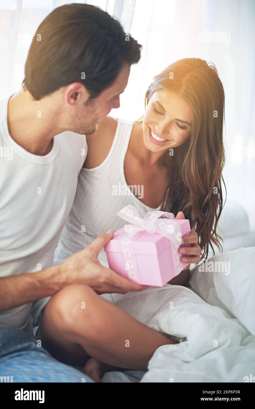 Tokens of love and appreciation. a loving husband giving his wife a gift. Stock Photo