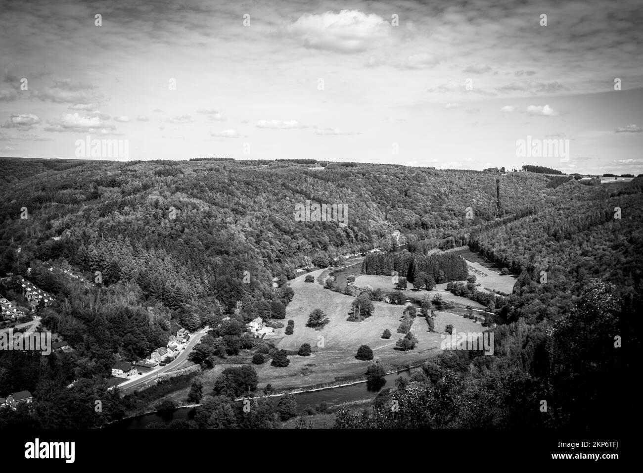 An aerial view of village surrounded by dense trees Stock Photo - Alamy