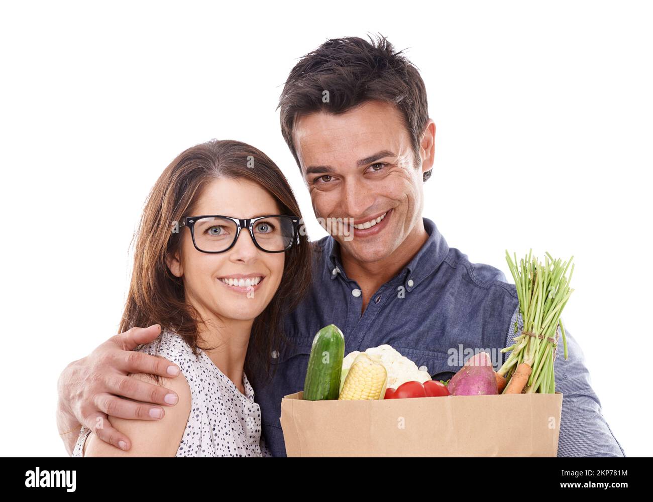Only the best for us. Studio portrait of a couple with groceries