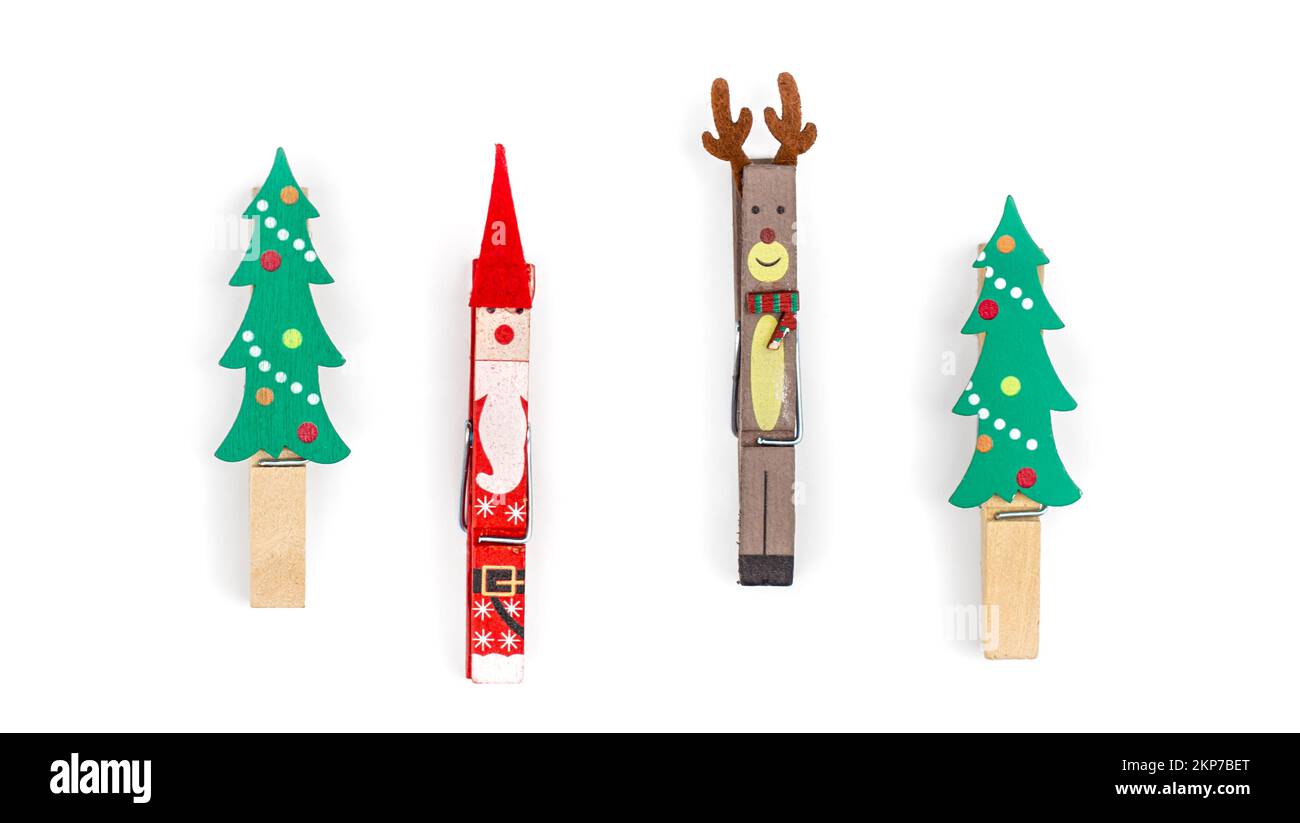 Christmas clothespins on white background isolated, flat lay. Stock Photo