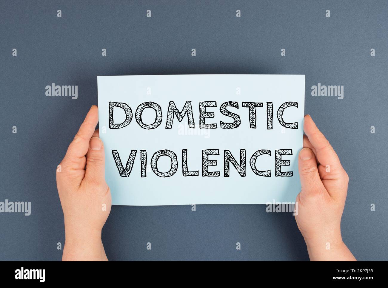Domestic violence is standing on the paper, international awareness month october for victims and survivors Stock Photo
