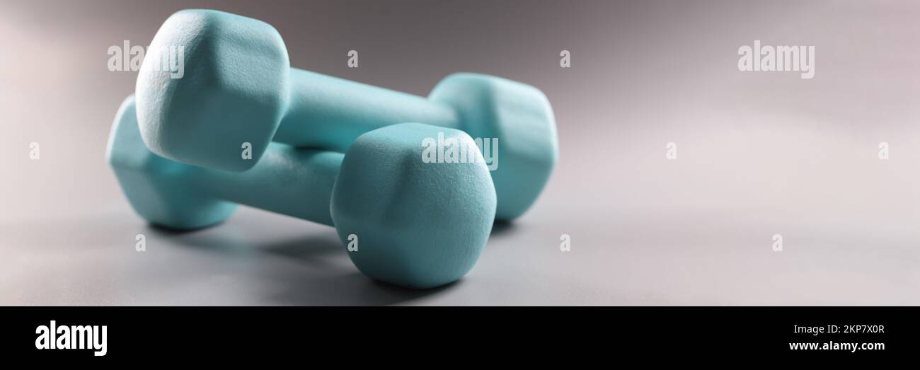 Heavy blue dumbbells for workout, plan weight loss, sport activity, get physical Stock Photo