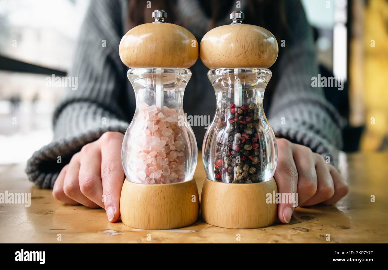 Salt and pepper shakers on light grey table, closeup. Space for text Stock  Photo - Alamy