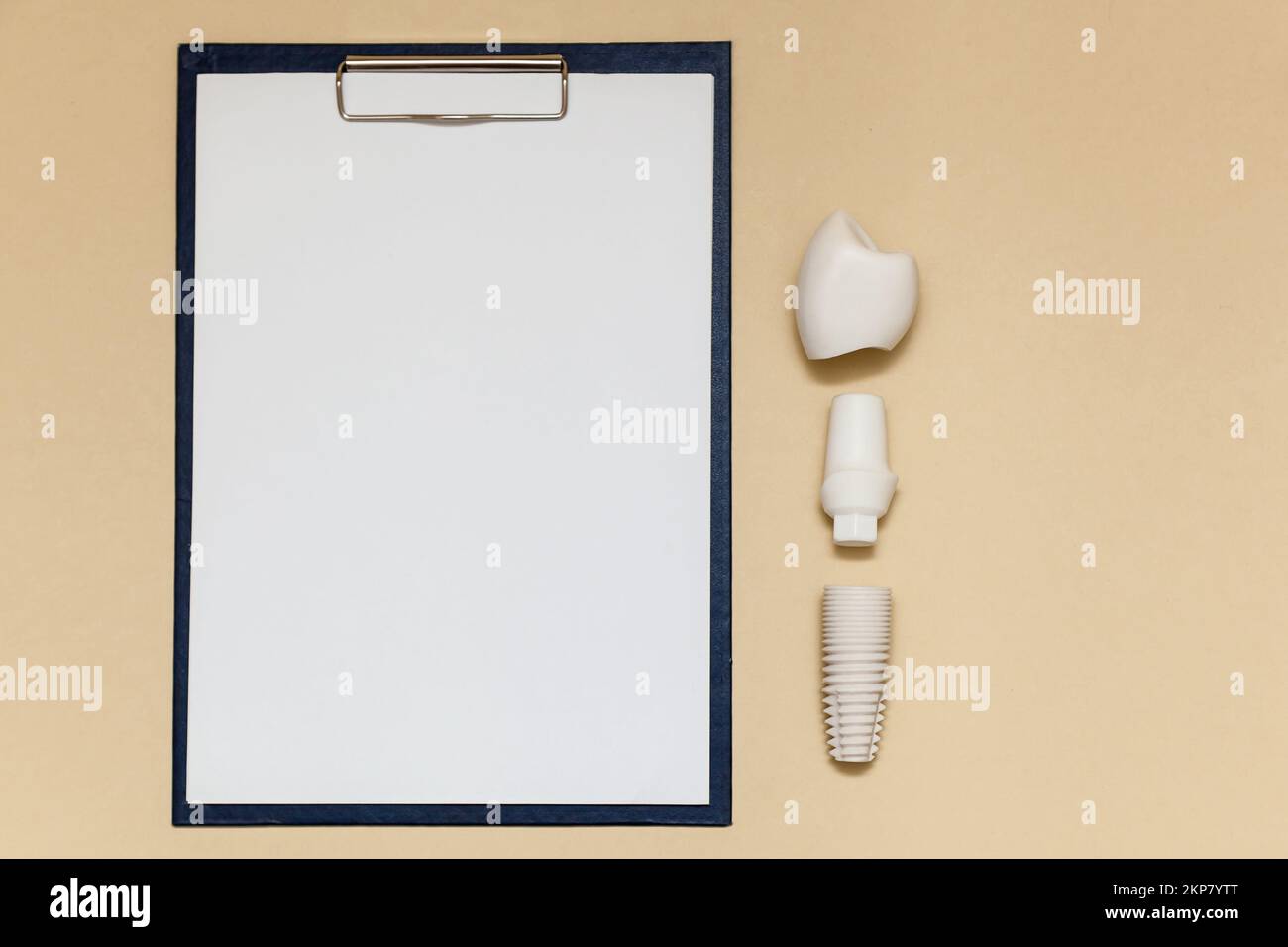 Dental implant and folder with clip for paper sheets A4 on beige ...