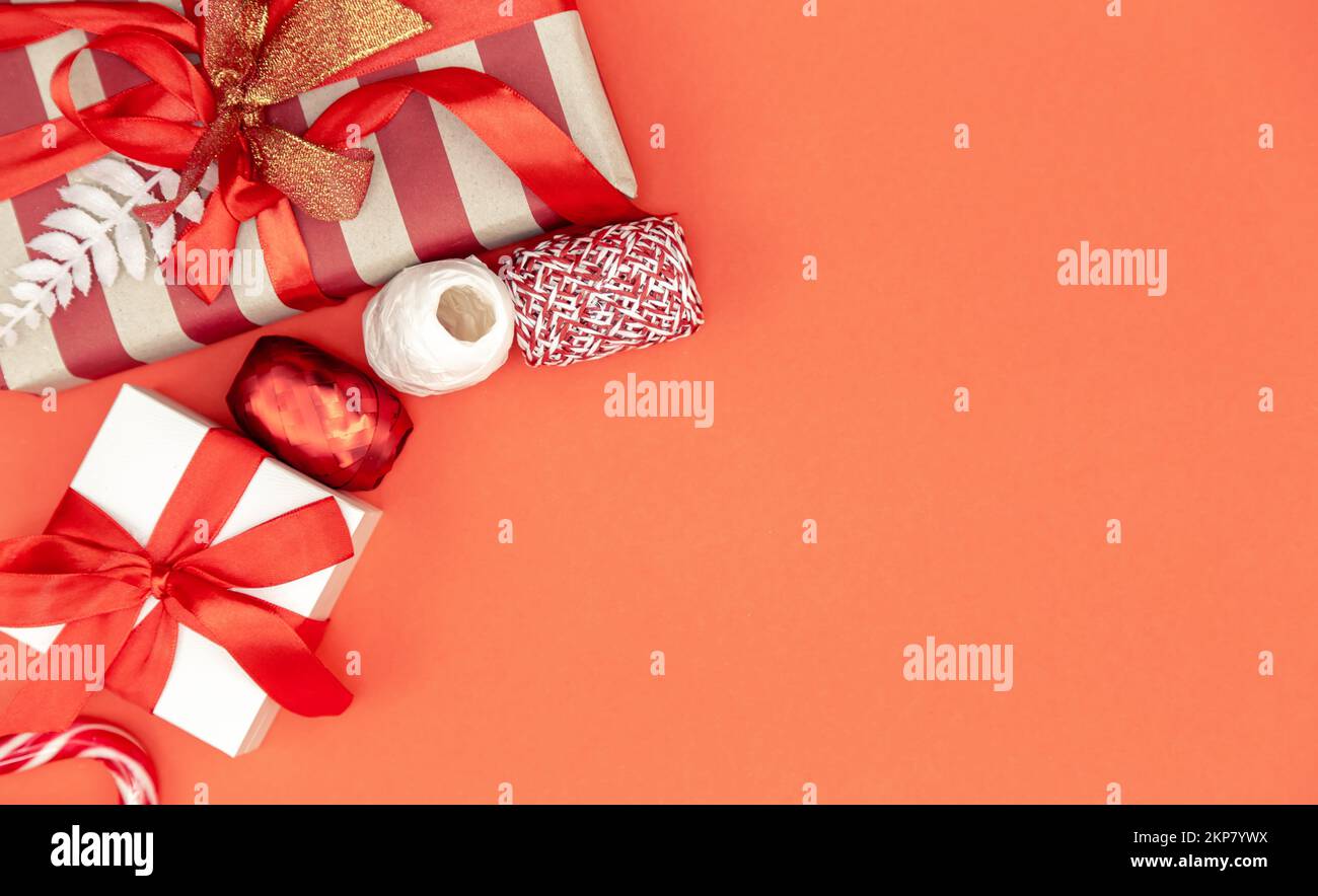 Christmas background with gift boxes and decor details, flat lay. Stock Photo