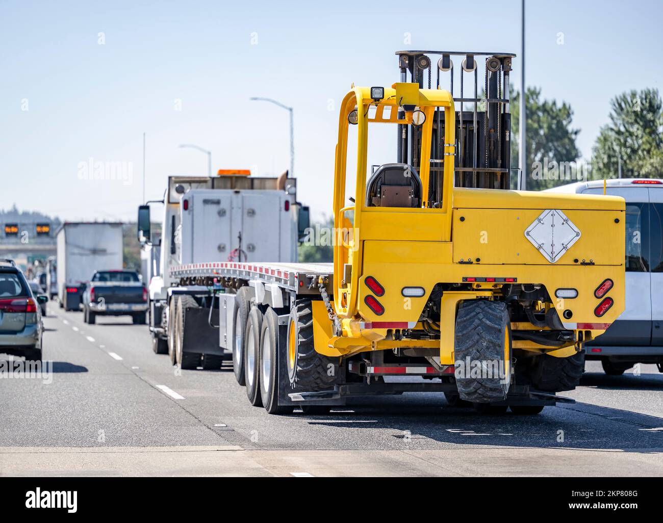 Industrial burgundy classic long haul big rig extended cab semi truck