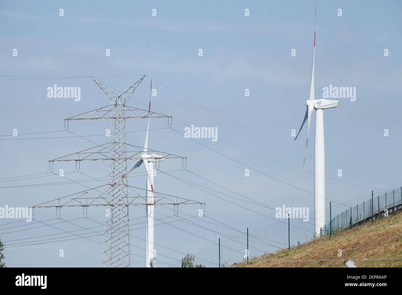 Wind turbines with power pole, Bremen, Germany Stock Photo