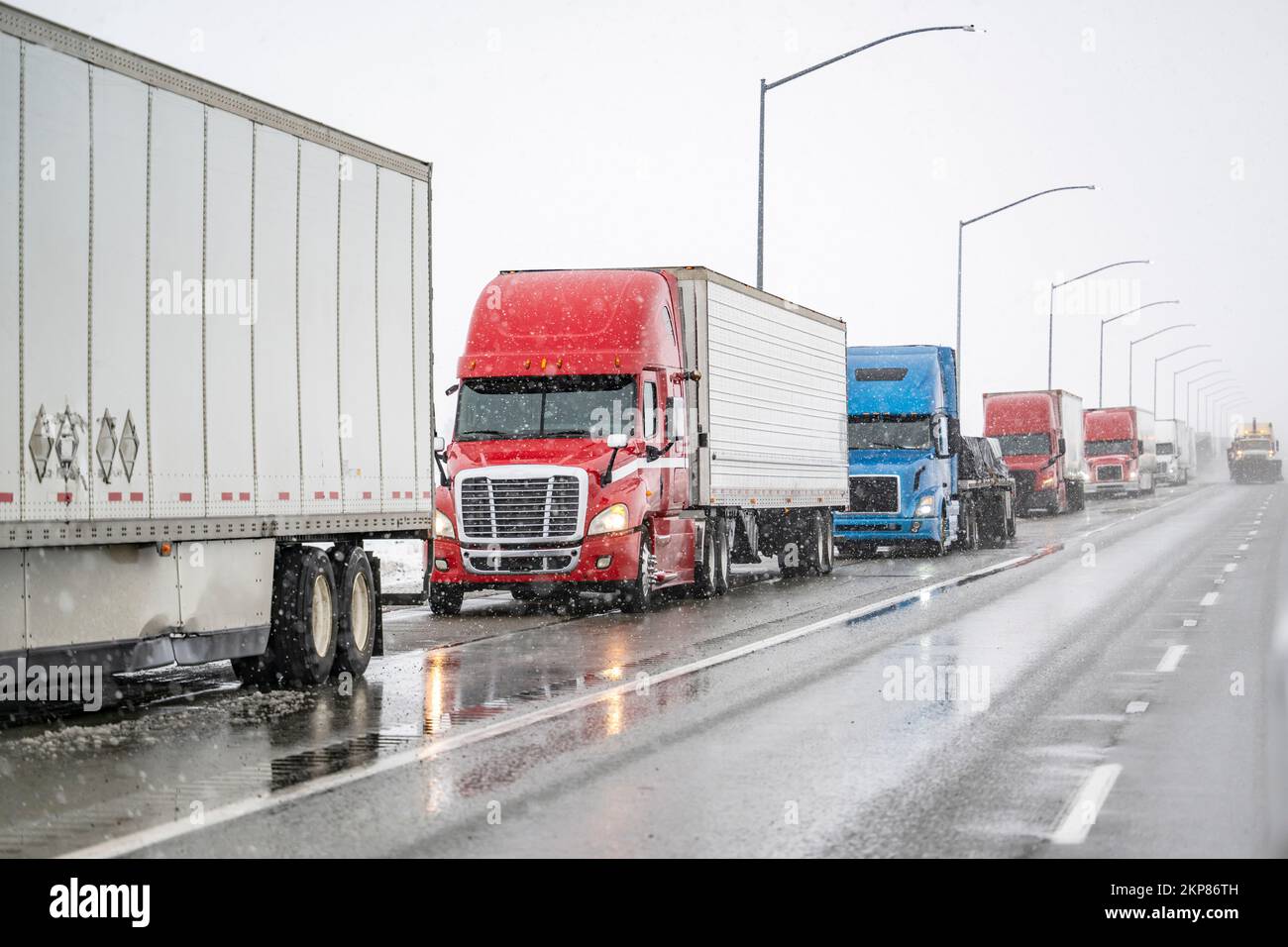 Convoy of industrial big rigs semi trucks with semi trailers ...
