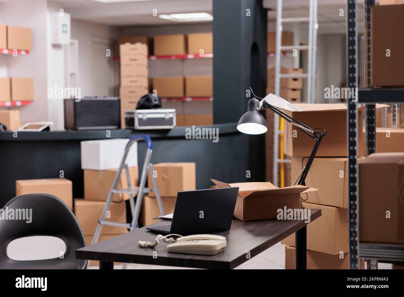 Empty large industrial warehouse equipped with tall metal shelves ...