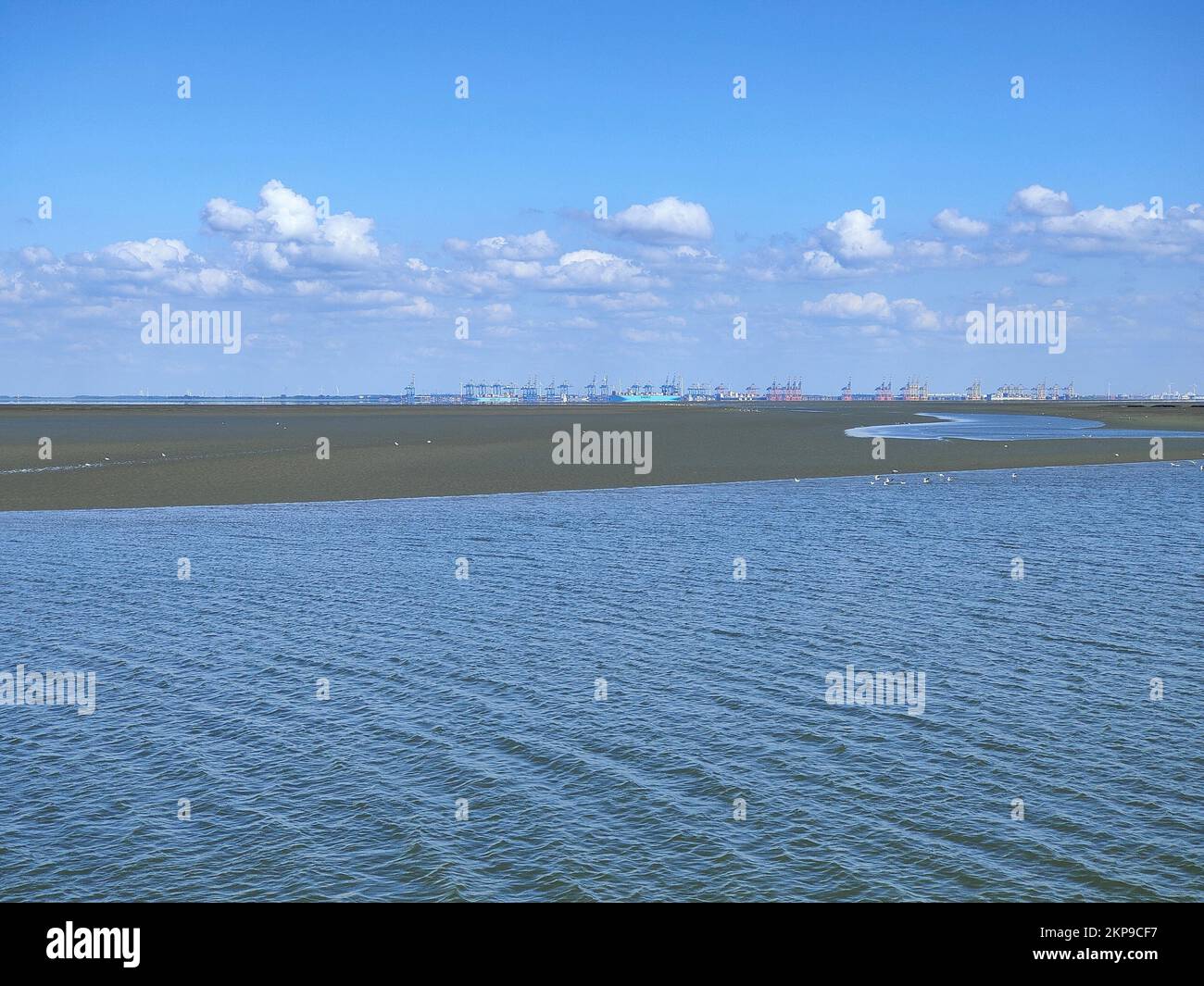 An aerial view of lake under blue bright sky Stock Photo - Alamy