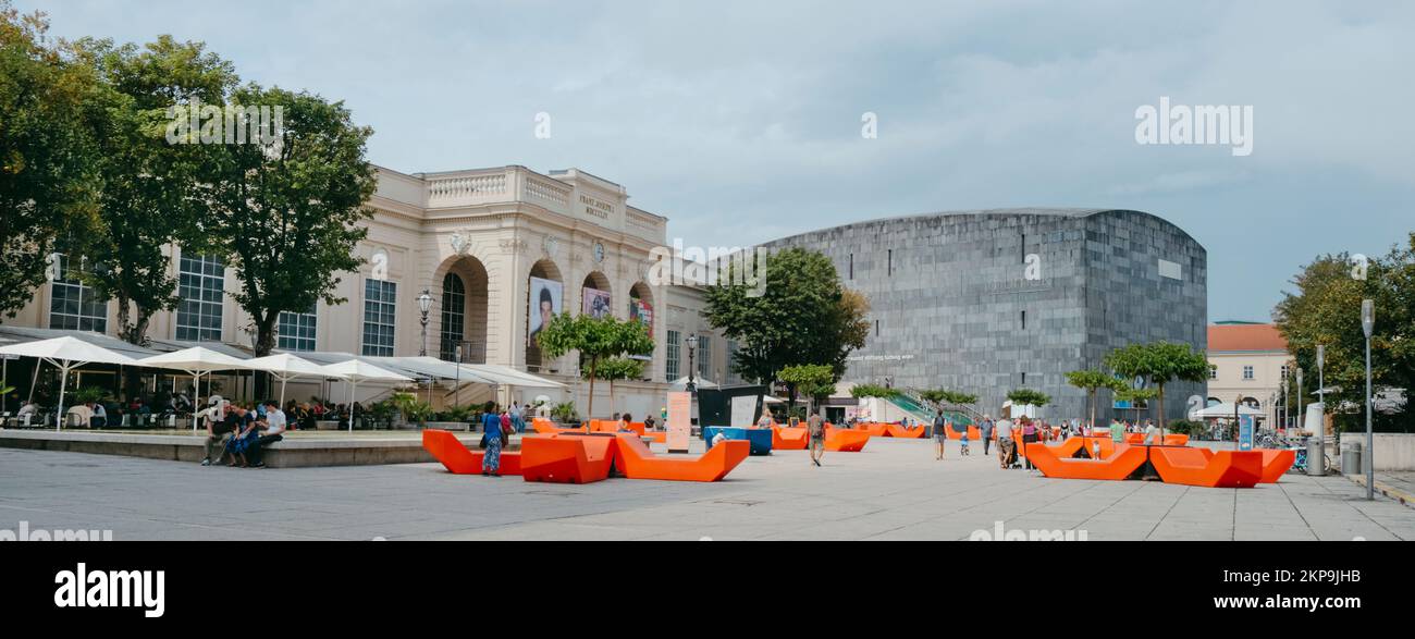 Vienna, Austria - August 28, 2022: Panoramic of the Museumsplatz square in Vienna, Austria, highlighting the modern building of the Mumok - Museum Mod Stock Photo