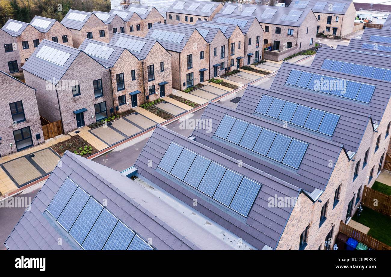 Aerial view of rows of energy efficient new build modular terraced houses in the UK with characterless design for first time buyers Stock Photo