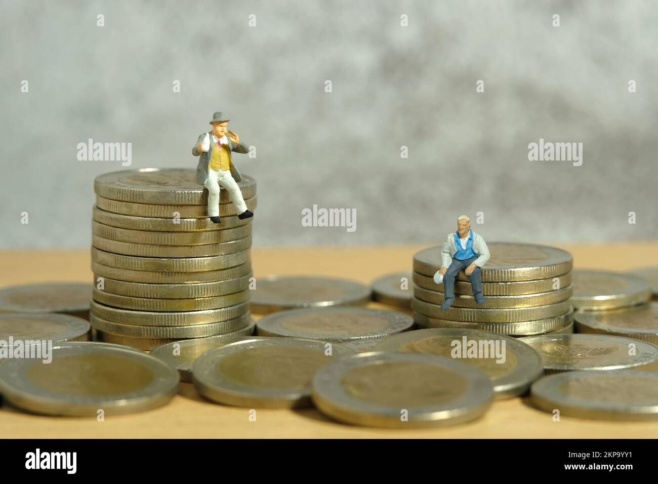 Miniature people toy figure photography. and wealth gap