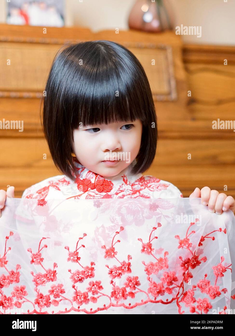 A vertical shot of a cute chinese girl with bob hairstyle in traditional  dress Stock Photo  Alamy