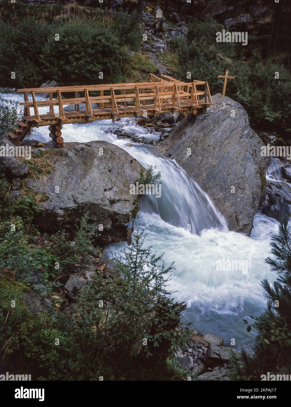 A vertical and long exposure shot of the waterfall in the forest Stock ...