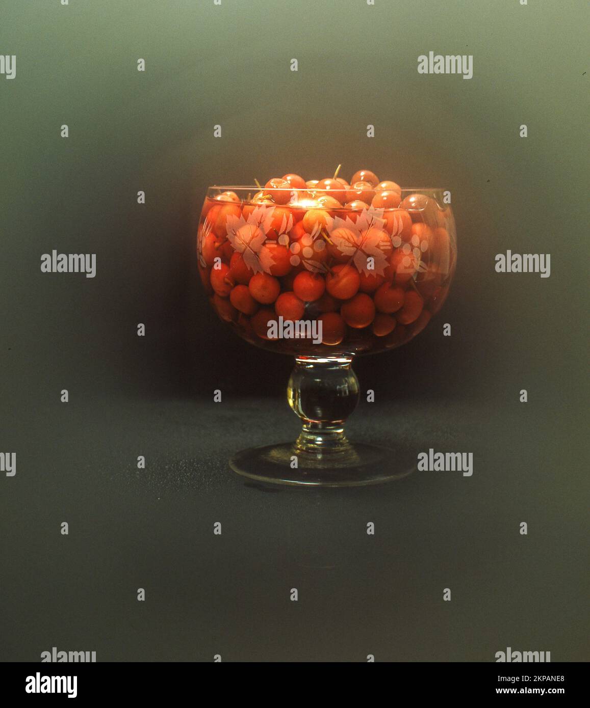 A still life shot of the Orange Gunda gumberries in a glass vase Stock Photo