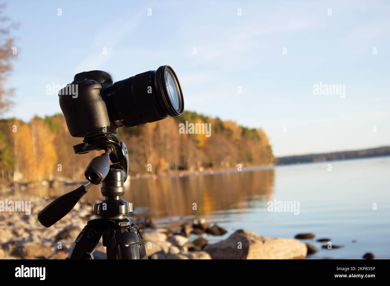 A view of the camera on tripod on the rocky beach Stock Photo - Alamy