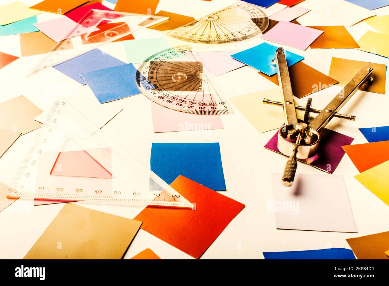 Colourful office art on a workspace scene of work tools of a measured
