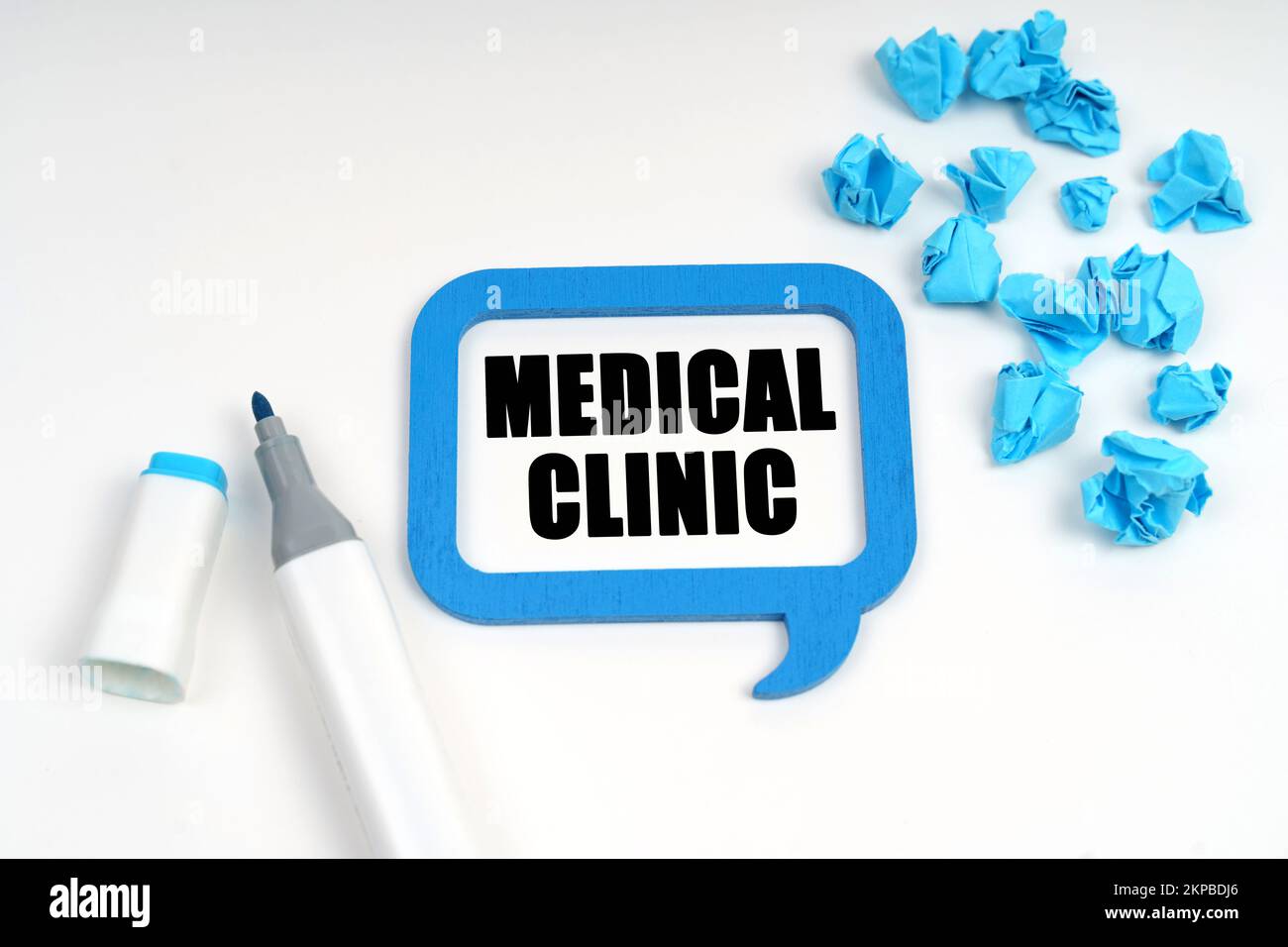 Medicine and health. On a white surface are crumpled blue paper, a