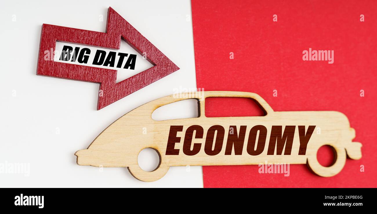 Business and economy concept. On a white and red background, a car and an arrow with the inscription - BIG DATA Stock Photo