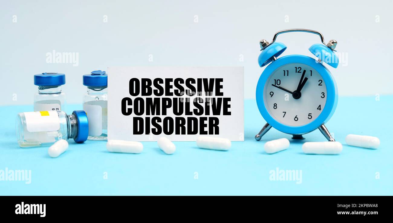 Medicine and health concept. An alarm clock, pills, injections and a