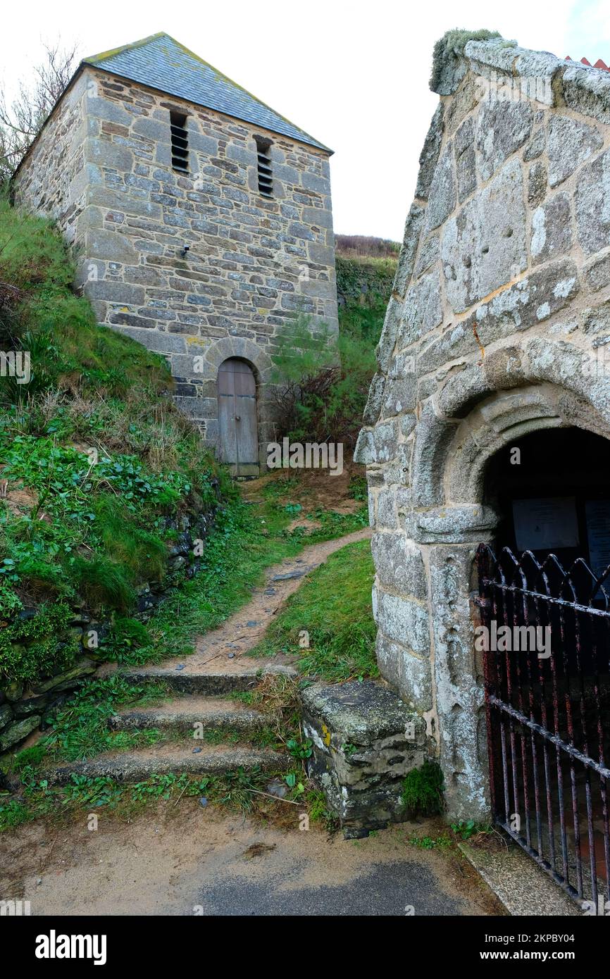 The church entrance and separate bell tower at Gunwalloe, Cornwall, UK ...