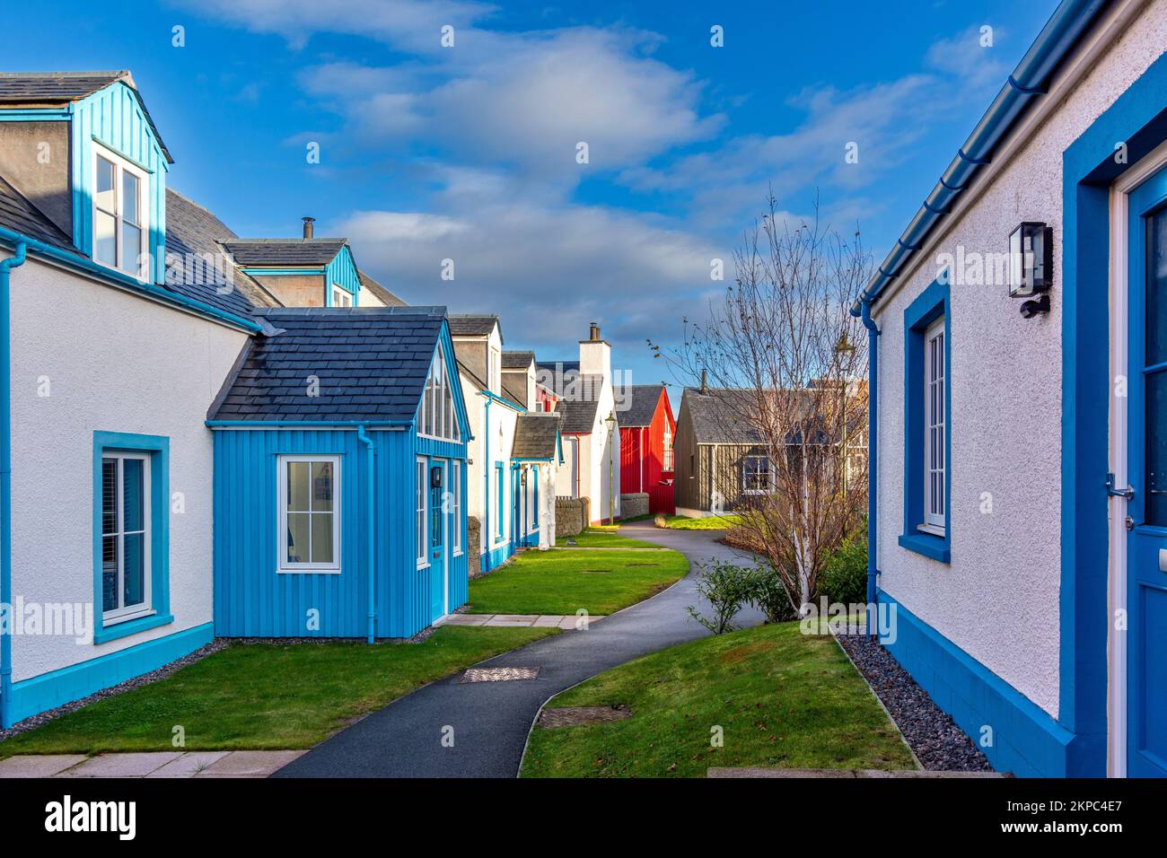 Tornagrain Inverness Scotland a planned village a footpath between coloured houses Stock Photo
