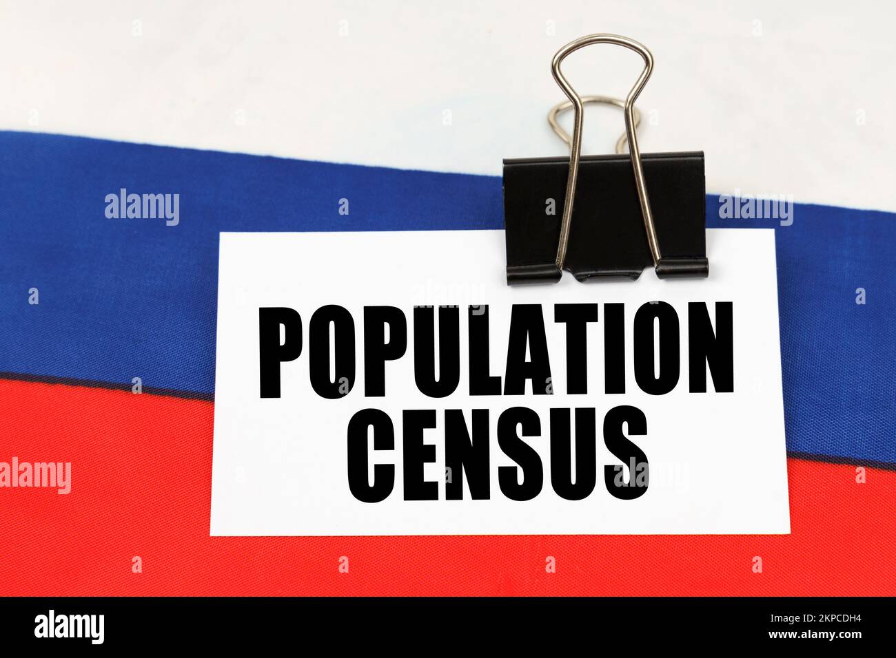 National concept. On the flag of Russia there is a business card with ...