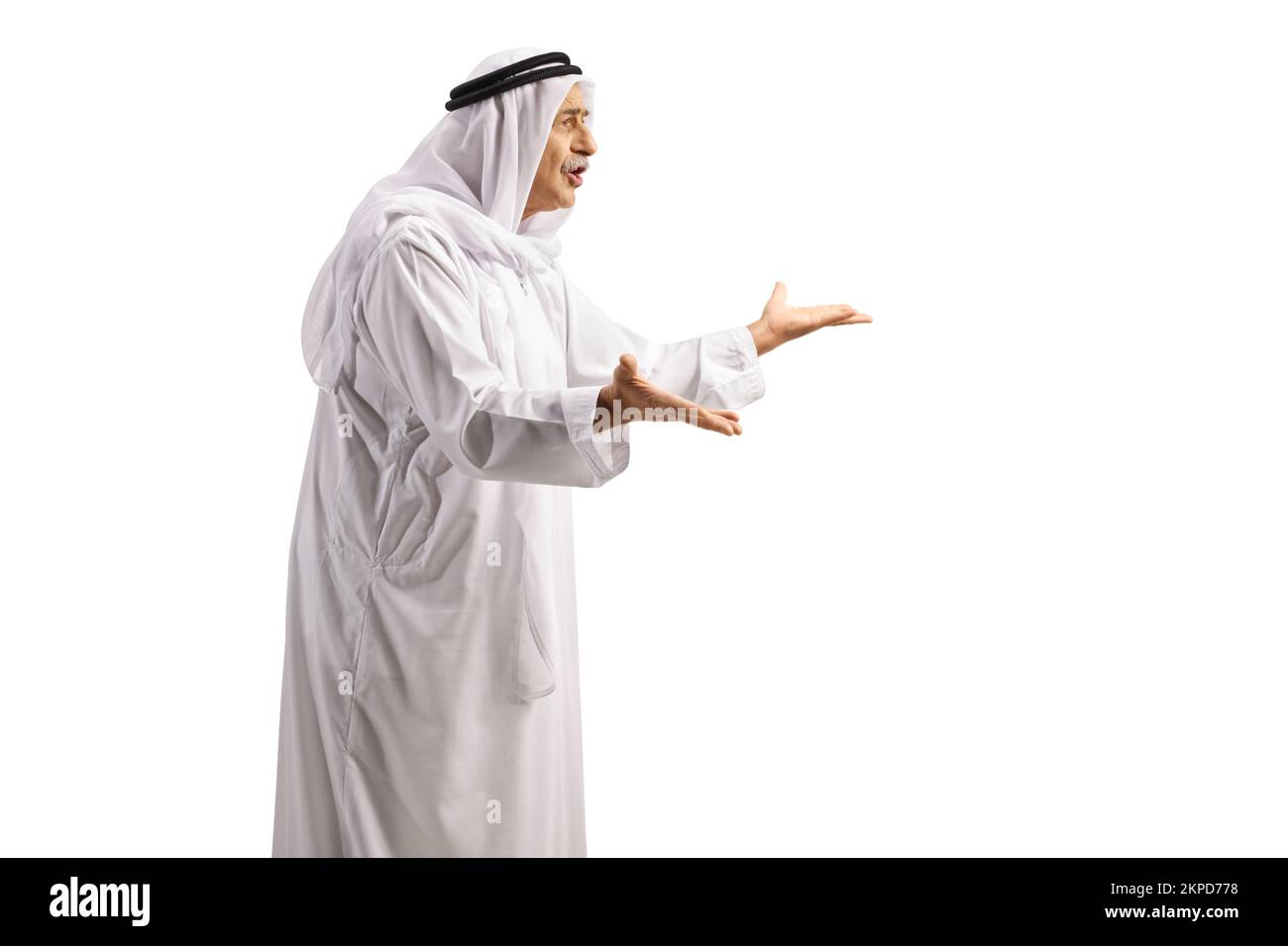 Full length profile shot of an angry mature arab man in a robe gesturing with hands isolated on white background Stock Photo