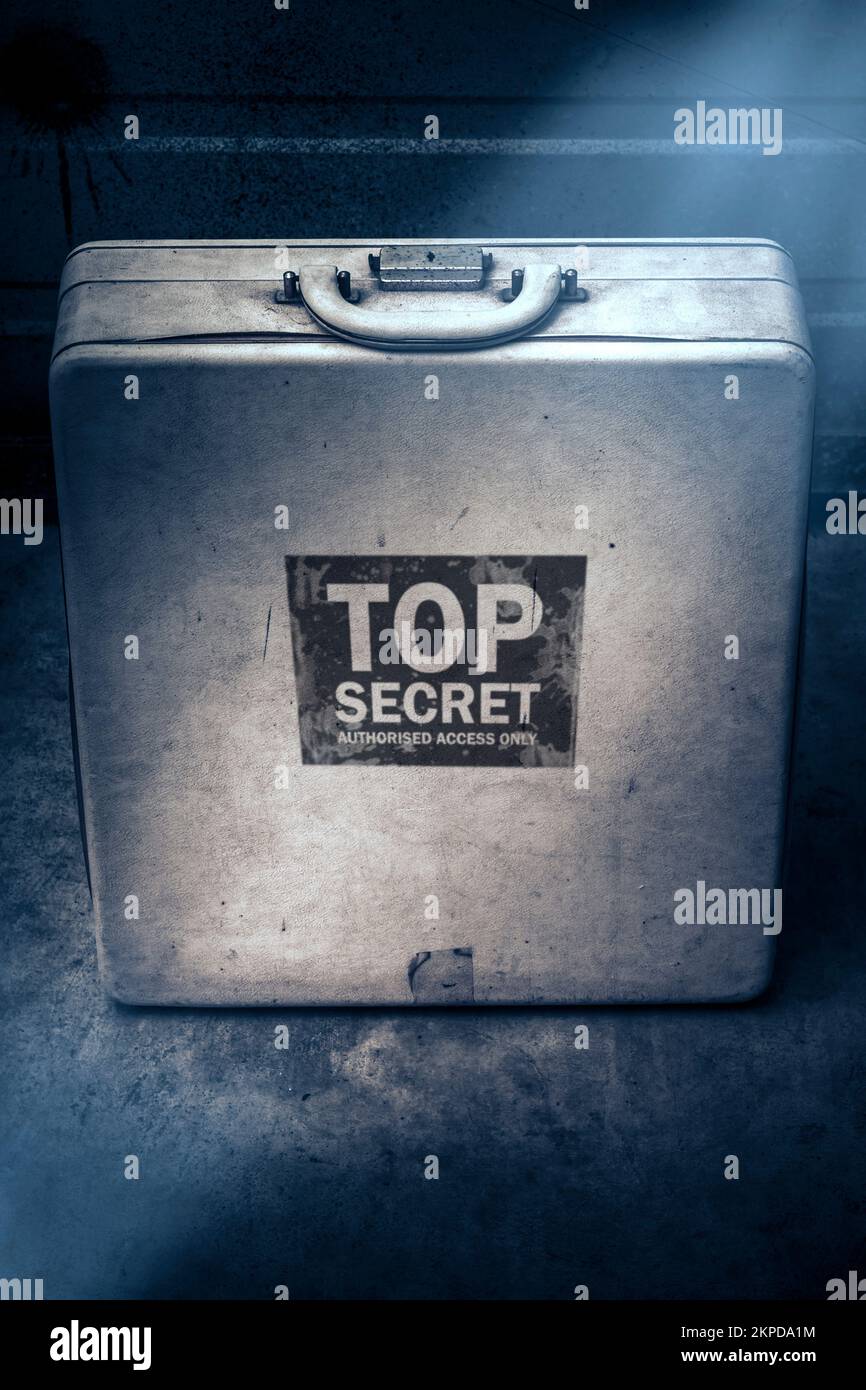 Vintage still life photo of an information packed top secret briefcase hiding classified secrets. Deceit in secret surveillance Stock Photo
