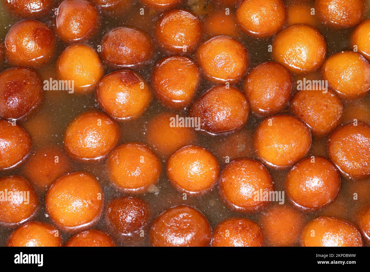 Rasgulla is a juicy milk based dessert loved by people all over India. These tiny juicy balls are addictive, and delicious and are made during times. Stock Photo