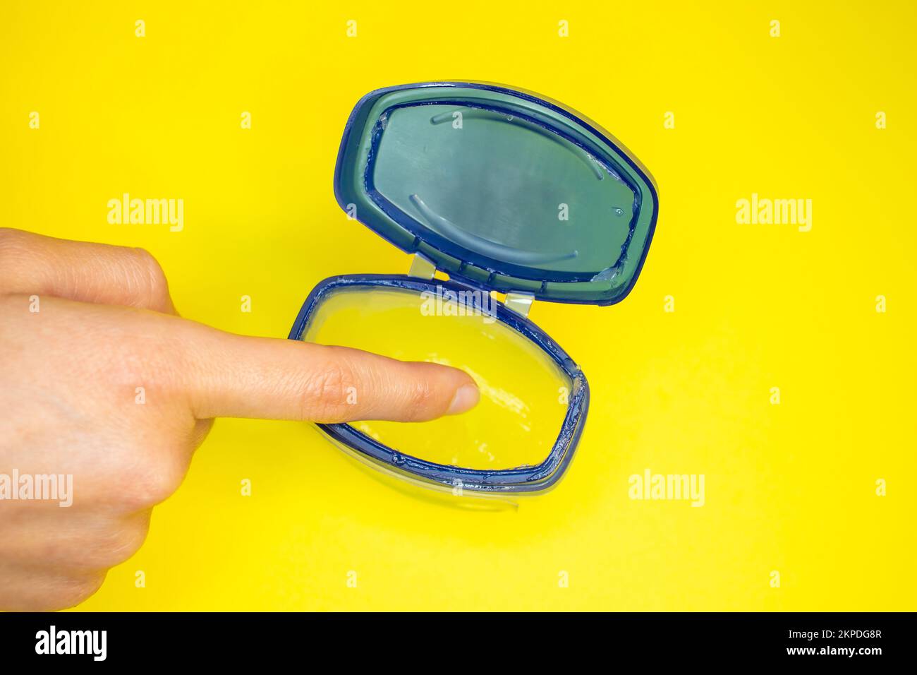 Hand with petroleum jelly. Skin care concept idea photo. Close up of
