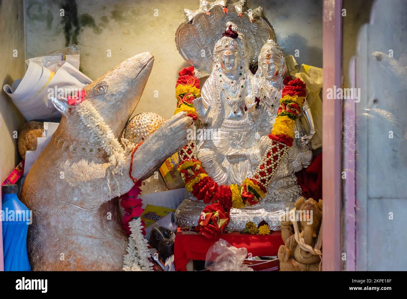 hindu lord shiva and parvati made of silver worshiped with flowers vertical shot from flat angle image is taken at ganesh temple ratanada jodhpur raja Stock Photo