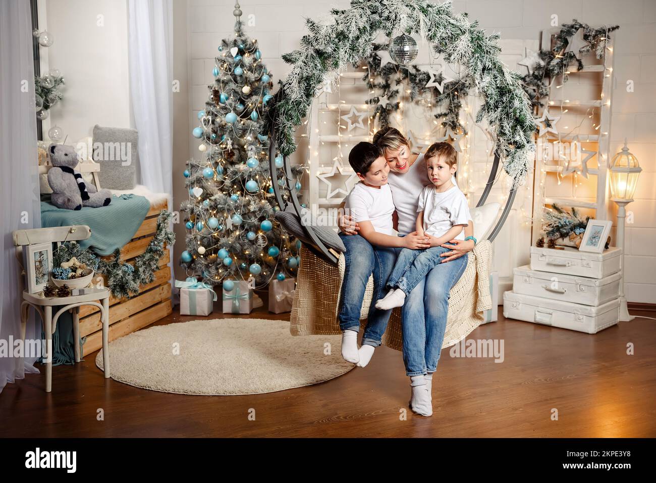 Mother and sons celebrating Ney Year at home. Family celebrating Xmas