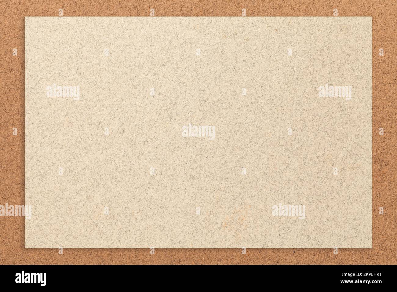 Texture of craft light beige color paper background with brown