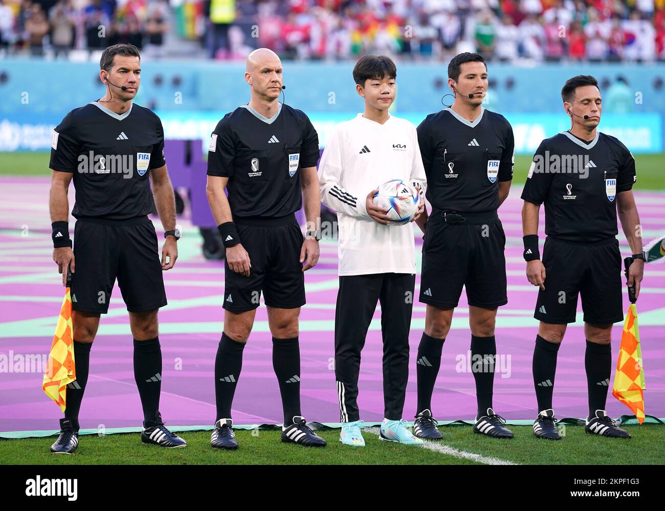 Referee Anthony Taylor with assistants Gary Beswick and Adam Nunn alongside the fourth official Kevin Ortega before the FIFA World Cup Group H match at the Education City Stadium in Al-Rayyan, Qatar. Picture date: Monday November 28, 2022. Stock Photo