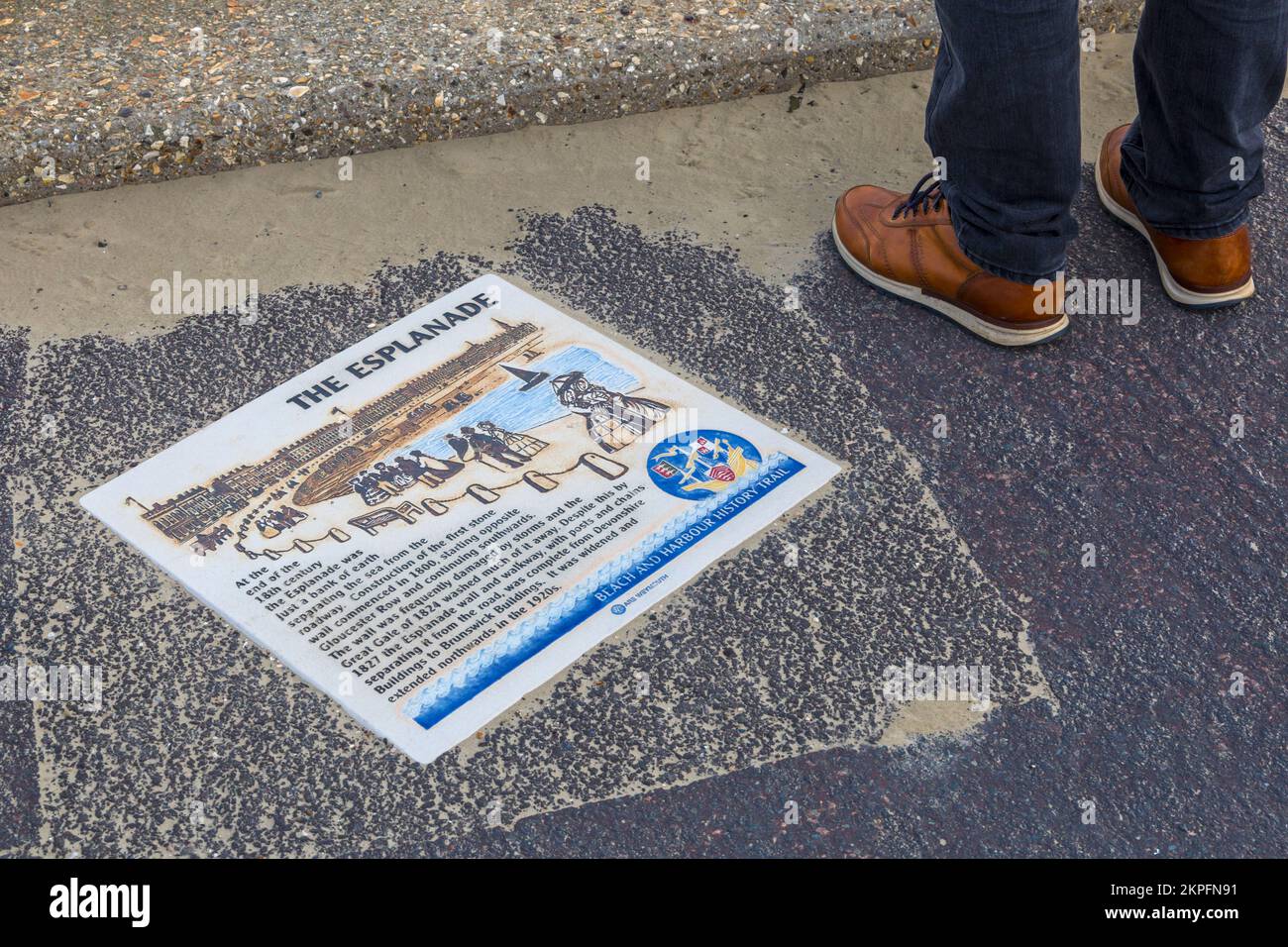 The Esplanade information sign on the ground at Weymouth beach, Dorset UK in October Stock Photo