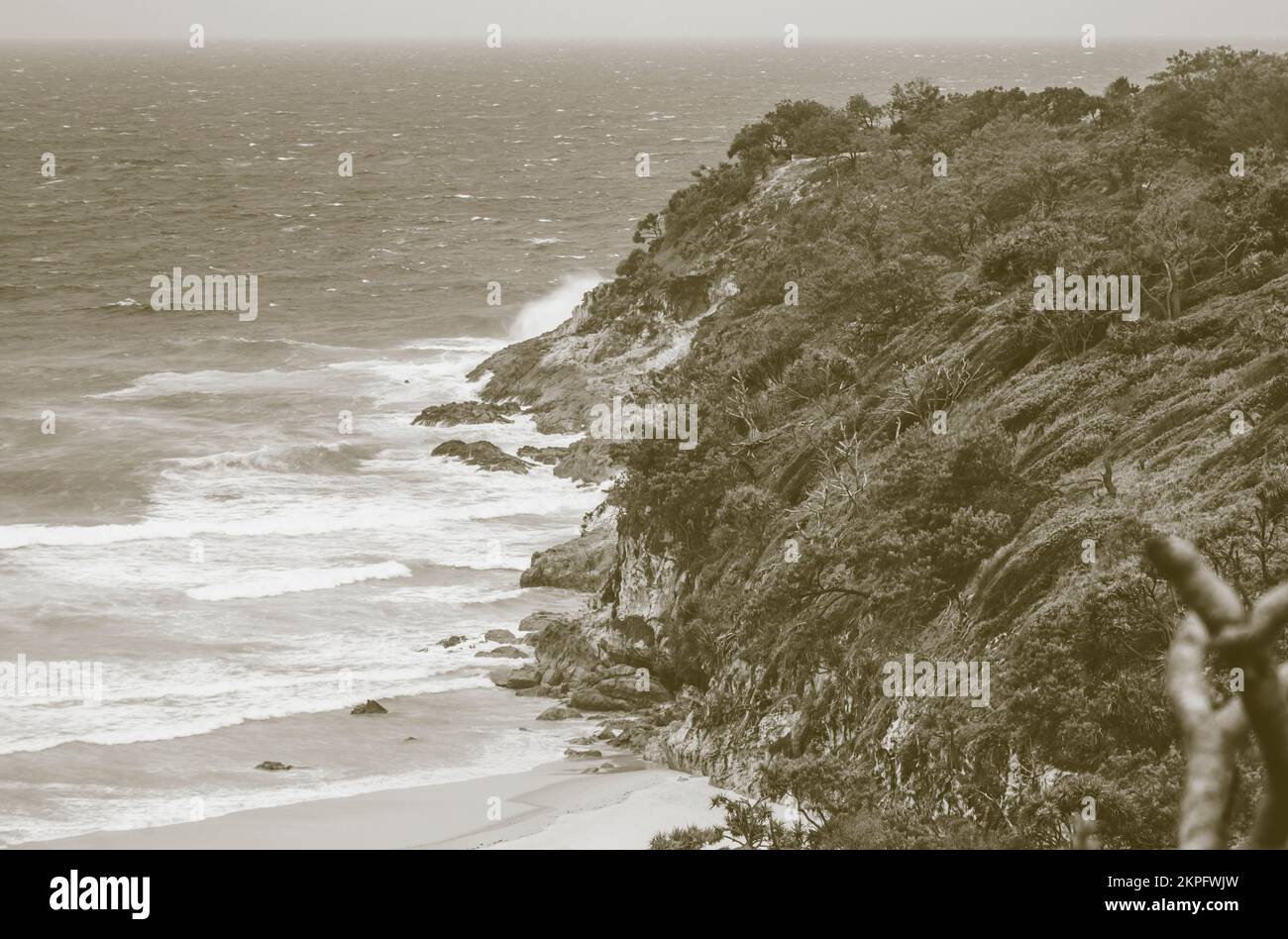 Antique stylised photograph on a sepia seafront of old cliffs and ocean