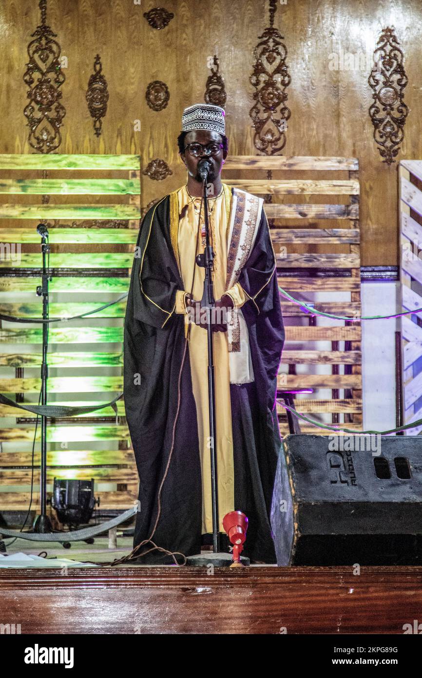 Nakuru, Kenya. 27th Nov, 2022. Spoken word artist Gregory Ochieng, who goes by stage name ''Mbunge Aliyeparara'' performs onstage during the release of his #Vitavyavina or ‘War of words' poetry album. Mbunge's poetry mainly highlights injustices and social issues in Kenya, among them, extrajudicial killings, profiling, government-sponsored enforced disappearances, and corruption, topics many regards as too risky to talk about. Credit: SOPA Images Limited/Alamy Live News Stock Photo