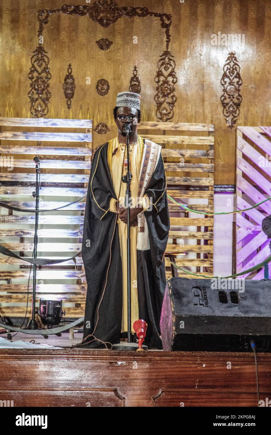 Nakuru, Kenya. 27th Nov, 2022. Spoken word artist Gregory Ochieng, who goes by stage name ''Mbunge Aliyeparara'' performs on stage during the release of his #Vitavyavina or ‘War of words' poetry album. Mbunge's poetry mainly highlights injustices and social issues in Kenya, among them, extrajudicial killings, profiling, government-sponsored enforced disappearances, and corruption, topics many regards as too risky to talk about. Credit: SOPA Images Limited/Alamy Live News Stock Photo