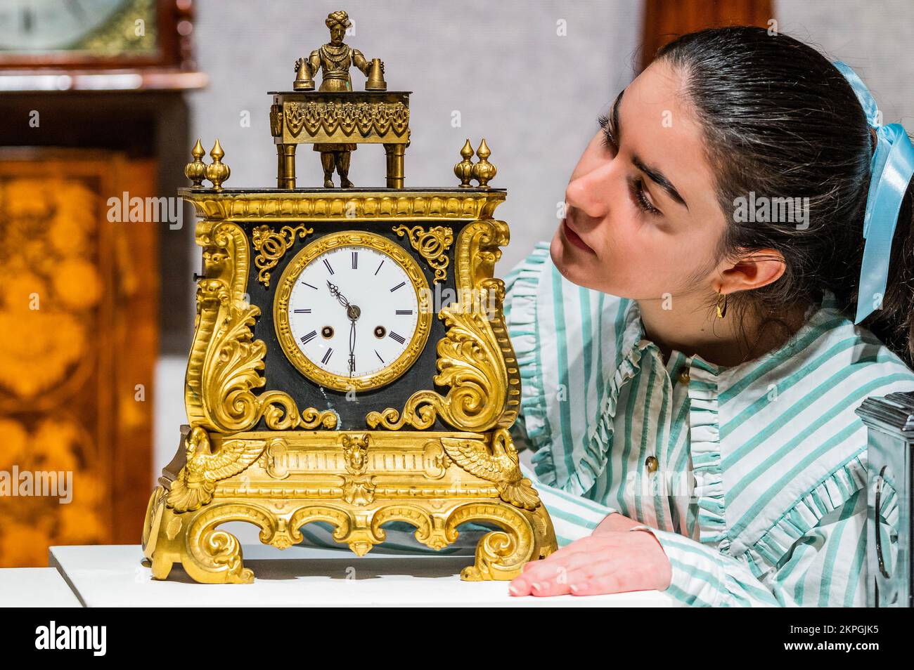 London, UK. 28th Nov, 2022. A rare second half of the 19th century automata novelty mystery 'Magician' mantel clock, The clock movement by Japy Freres, numbered 839, est £6,000 - £8,000. The magician, on top, is able to raise his arms and is articulated at the base of his neck in order to bow in acknowledgement of his performances and appears to make objecst appear and disappear - Preview of Fine Clocks sale at Bonhams New Bond Street, London. Credit: Guy Bell/Alamy Live News Stock Photo