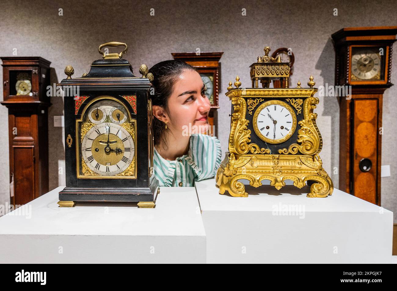 London, UK. 28th Nov, 2022. A rare second half of the 19th century automata novelty mystery 'Magician' mantel clock, The clock movement by Japy Freres, numbered 839, est £6,000 - £8,000. The magician, on top, is able to raise his arms and is articulated at the base of his neck in order to bow in acknowledgement of his performances and appears to make objecst appear and disappear - Preview of Fine Clocks sale at Bonhams New Bond Street, London. Credit: Guy Bell/Alamy Live News Stock Photo