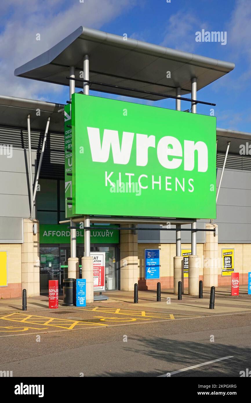 Close up large green store sign for Wren Kitchens retail manufacturing business showroom entrance Lakeside Retail Park West Thurrock Essex England UK Stock Photo