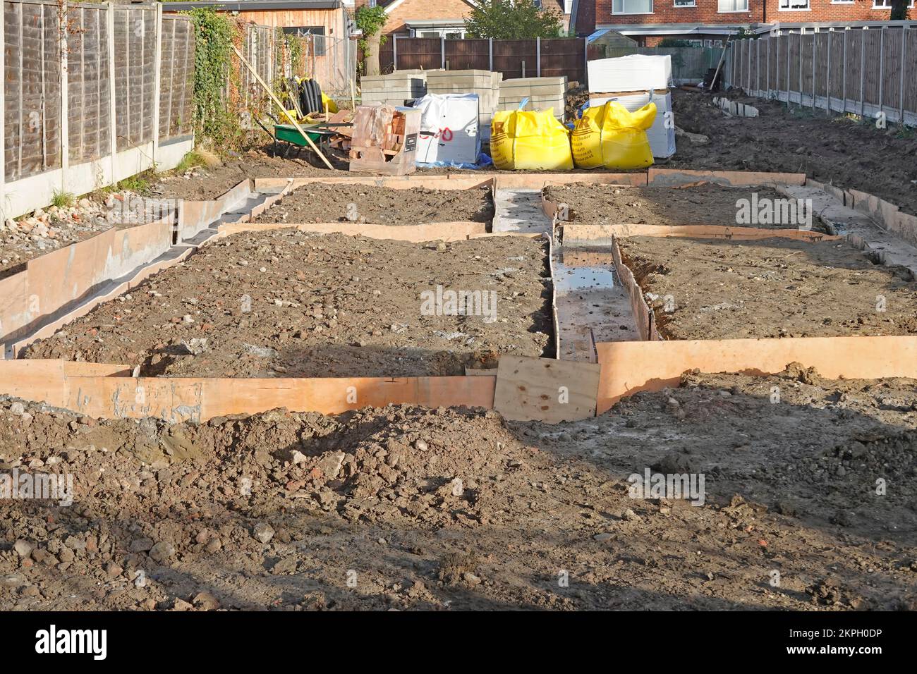 Pumped ready mixed concrete delivered by hose from road direct into