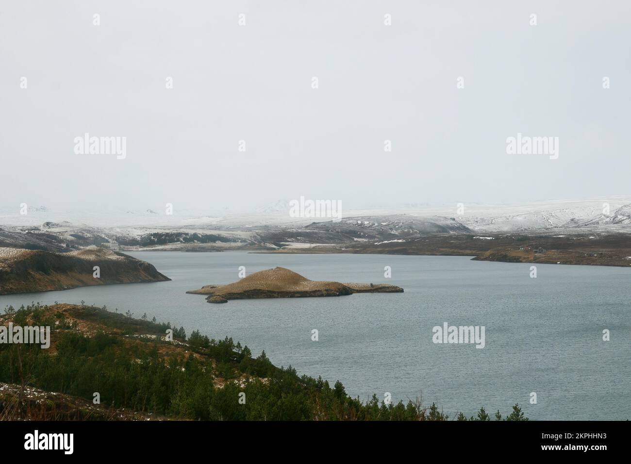 A typical icelandic landscape with a view mountains, lakes rivers and snow by spring Stock Photo