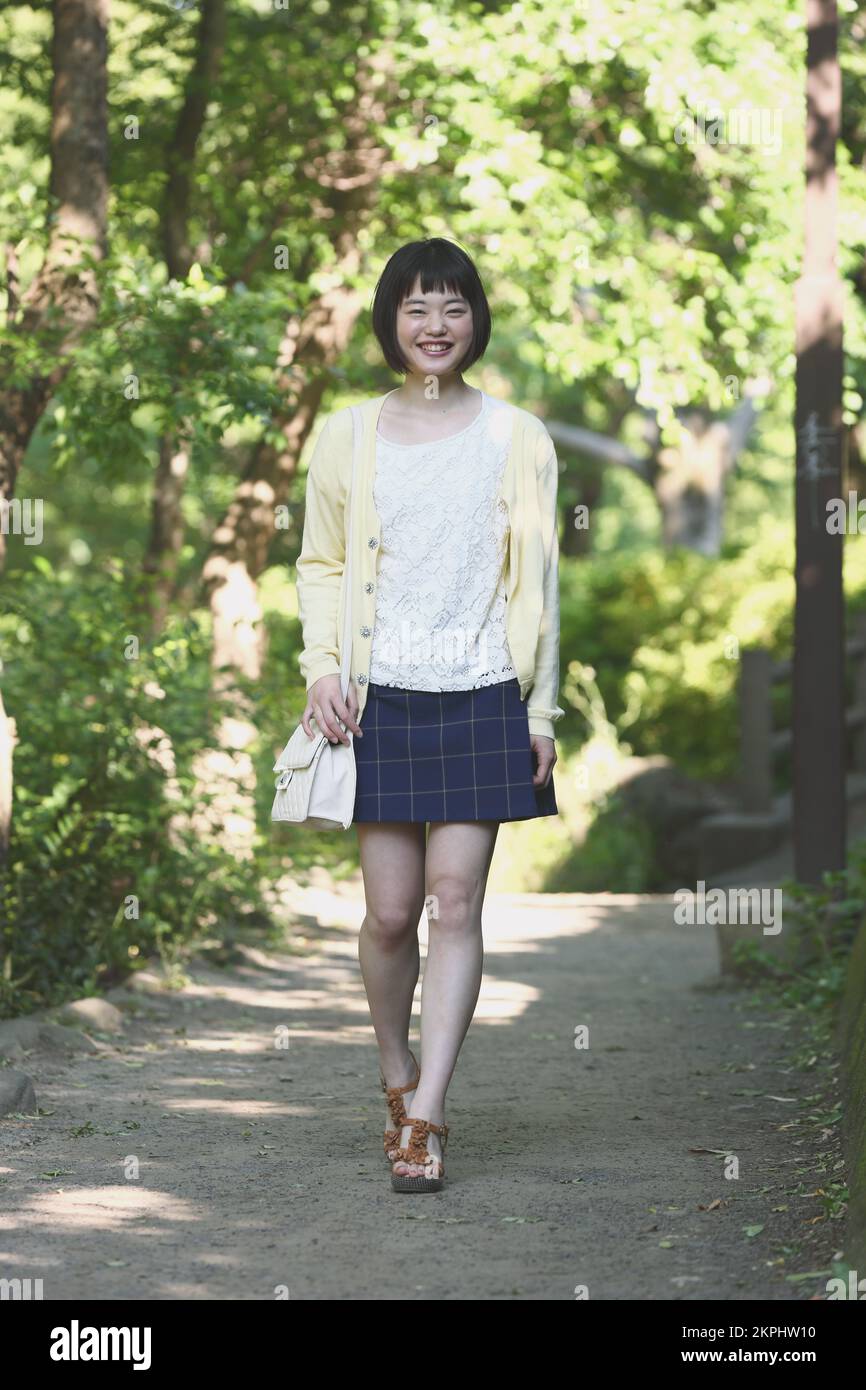 Young Japanese woman taking a walk Stock Photo - Alamy