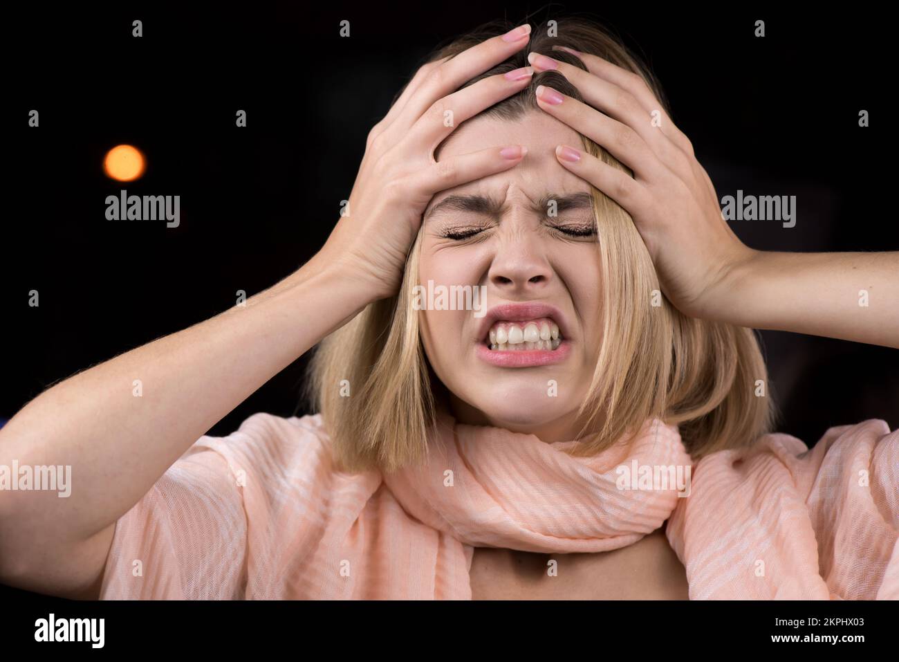Young woman with headache. Portrait of a model with closed eyes